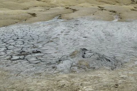 Active mud volcano crater. Mud Volcanoes (Vulcanii Noroiosi) geological reser Stock Photos