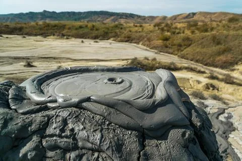 Active mud volcano eruption captured in Romania Stock Photos
