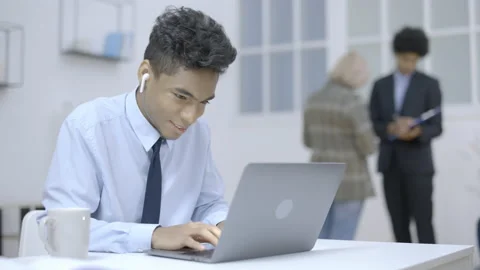 Active office employee playing games on laptop, intern procrastinating at work Video stock 150861632