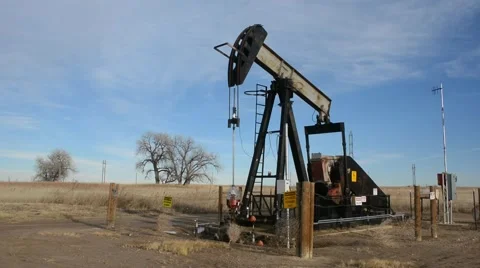 Active Oil Pump Pumpjack in a Field Stock Footage 57645482