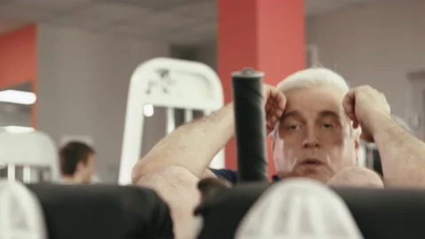 Active Older Man at Gym Training Press and Healthy Body. 50s Person Inside Fitne Stock-Footage 199478895
