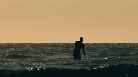 Active paddle boarder. Black sunset silhouette of young sportsman Video stock 138038023