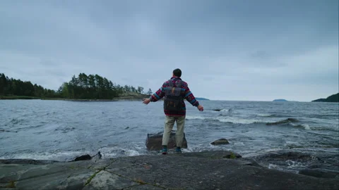 Active Pastime And Trip In Weekend, Male Tourist Standing Alone On Coast Of Stock Footage 254119424