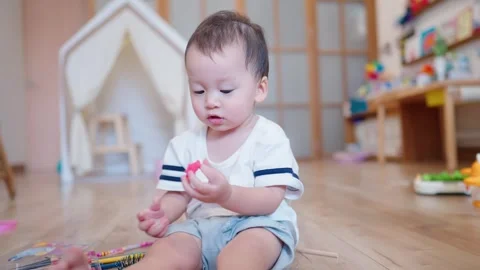 Active playful kid staring learning how to do. Art Colorful Craft Toy. Stock Footage 274842356