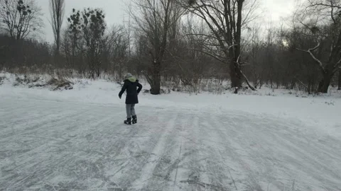 Active recreation during winter holidays. girl ice skating on the lake Stock Footage 219688219