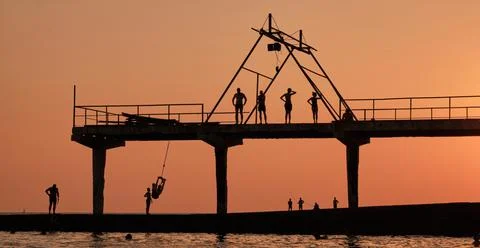 Active rest on sea. Shadow drawing of people. Stock Photos