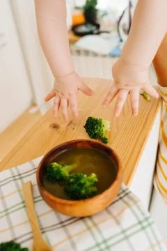 Active restless infant child is given food Stock Photos