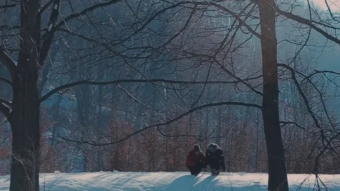Active retired couple walking in the snow Stock Footage 72410639
