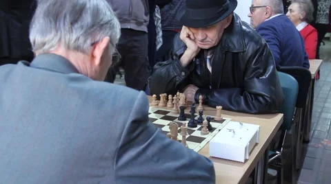 Active Retired Seniors, Two Old Men Playing Chess At old folks club 3 Stock Footage 60236146
