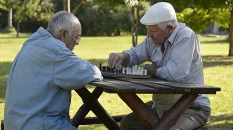 Active retirement and free time, four elderly men playing chess Stock Footage 13746534