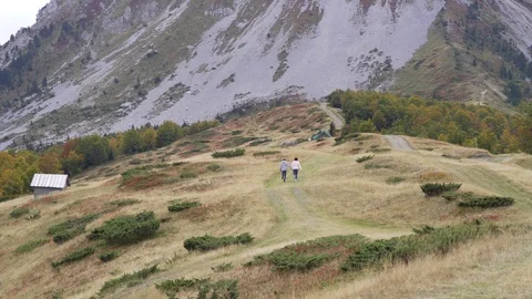 Active senior couple runing at the mountains, enjoying their adventure Stock Footage 126064834