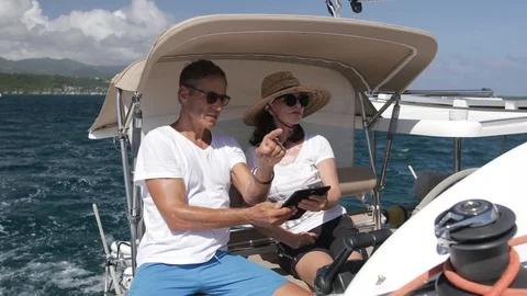 An active senior couple sailing 12 Stock Footage 99328470