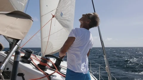 An active senior couple sailing 24 Stock Footage 99331387