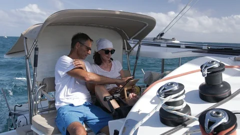 An active senior couple sailing 30 Stock Footage 99333546