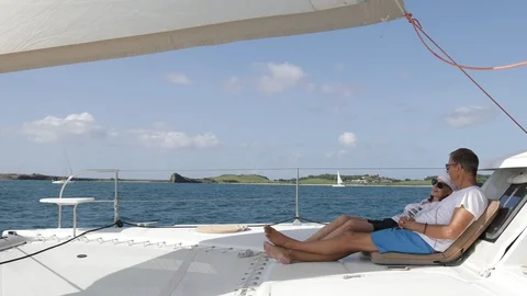 An active senior couple sailing 33 Stock Footage 99334004