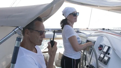 An active senior couple sailing 34 Stock Footage 99423368