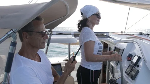 An active senior couple sailing 35 Stock Footage 99334189