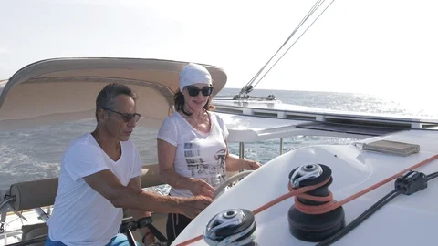 An active senior couple sailing 37 Stock Footage 99334521