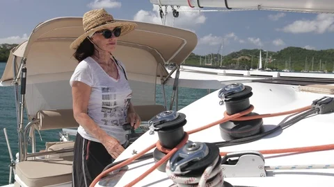 An active senior couple sailing 4 Stock Footage 99326606