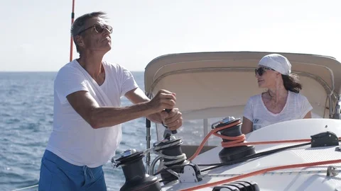 An active senior couple sailing 43 Stock Footage 99336716