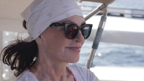 An active senior couple sailing 47 Stockbeeldmateriaal 99336907