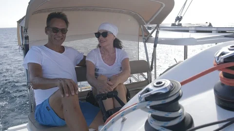 An active senior couple sailing 53 Stock Footage 99337859