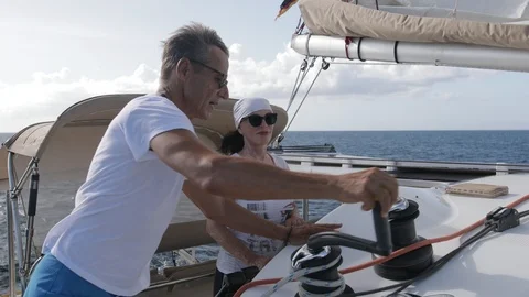 An active senior couple sailing 57 Stock Footage 99338796