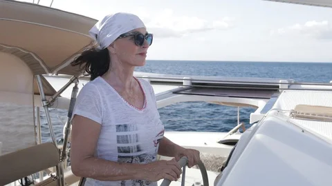 An active senior couple sailing 60 Stock Footage 99339021