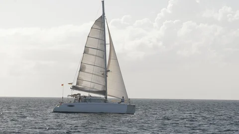 An active senior couple sailing 65 Stock Footage 99340070