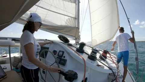 An active senior couple sailing 76 Stock Footage 99342627