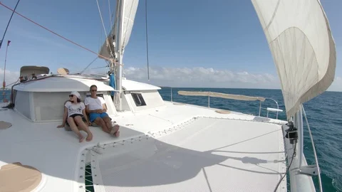 An active senior couple sailing 77 Stockbeeldmateriaal 99342041