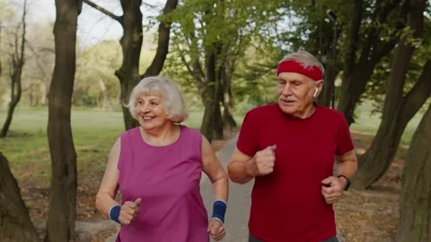 Active senior elderly couple doing cardio morning exercise workout. Man, woman Stock Footage 139661751