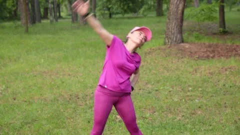 Active Senior Exercising in Park Stock Footage 276504291