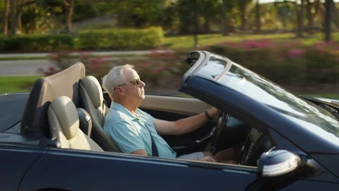 Active Senior Man Drives His Luxury Convertible In Sunny Florida Stock Footage 88017228