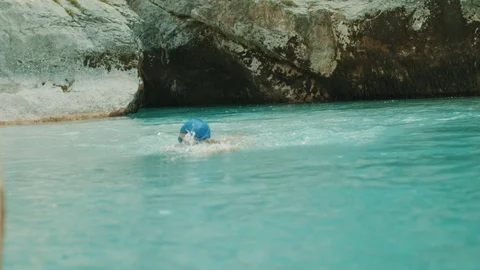 Active Senior Man, Swimming in The Cold Glacier Water  Stock Footage 94031955