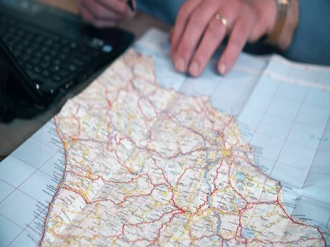 Active senior planning holiday vacation with laptop and map Stock Footage 74431732