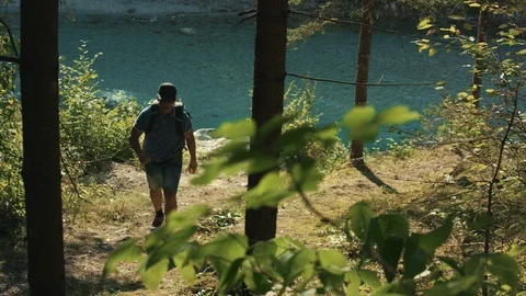 Active Senior Taking A Break In The Shade From A Hike Along The River Creek  Stock Footage 94031831