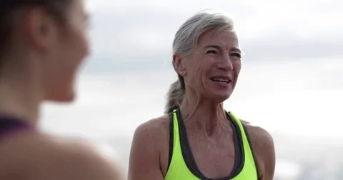 Active senior woman outdoors exercising Stock Footage