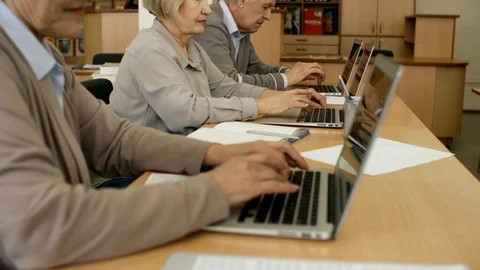 Active Seniors Learning to Code with Computer Stock Footage 99258750