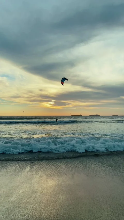 Active sport people practicing kite surfing on deep blue sea water Stock Footage 221473000