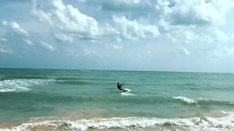 Active sport people practicing kite surfing, falling in water Stock Footage 229677511