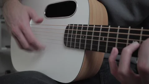 Active Strumming on Acoustic Guitar Stock Footage 328704336