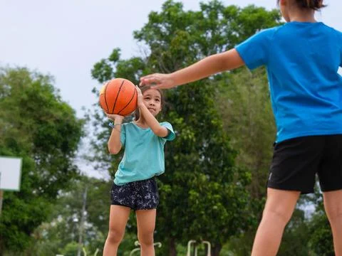 Active students practicing basketball drills during physical education class Stock Photos