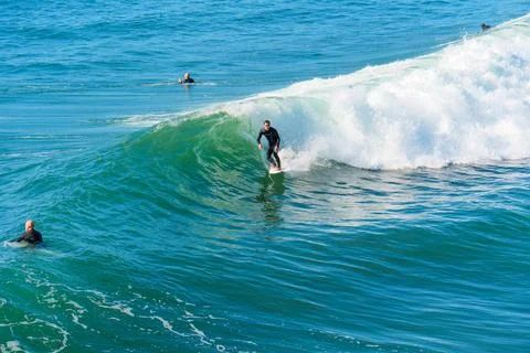 Active Surfer Riding Breaking Wave in Oceanside, California Stock-Fotos