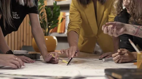 Active teamwork on an architectural plan project in the office. Stock Footage 223102829