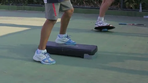 Active tennis players warm up before exercise Stock Footage 69236308