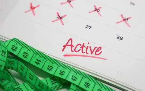 Active text on calendar with measuring tape. Concept of physical activity, .. Stock Photos