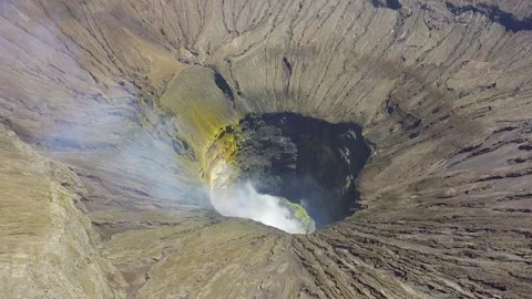 Active volcanic crater of Mount Bromo, Indonesia with smoke Stock Footage 174905924