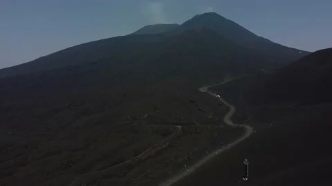 An active volcano. Dark ashy fields. Lots of heat. Black fields of ash. Stock Footage 231784425