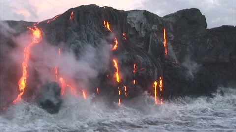 Active volcano disgorging hot lava Stock Footage 44231357